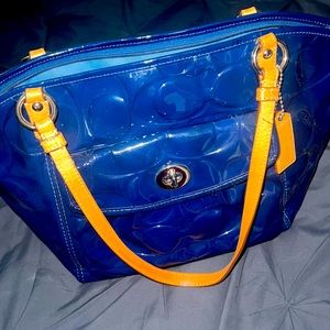 Blue Coach bag.